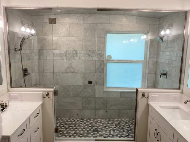 Shower enclosure with stone walls and double sinks
