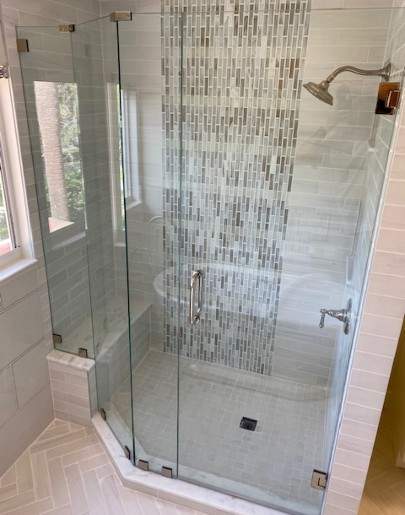 Shower enclosure with  mosaic tile accent