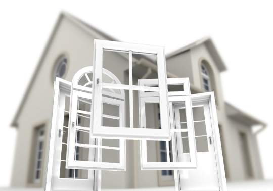 3D rendering of different types of windows protruding from a tall gray house. 