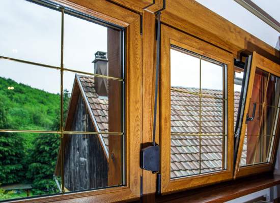 Picture windows with oak framing the glass