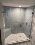 Shower enclosure with gray brick